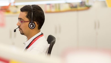 Man using headset in call centre