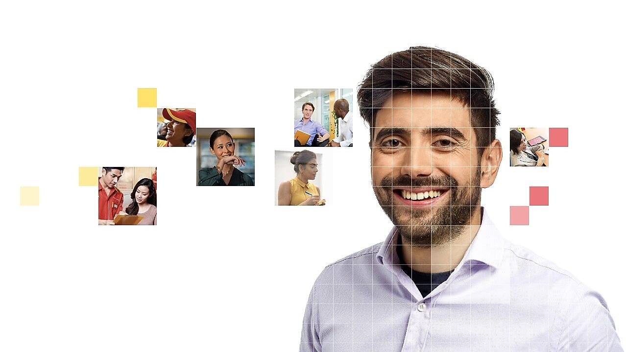 Male with beard wearing a white shirt, with a mosaic of images surrounding him.