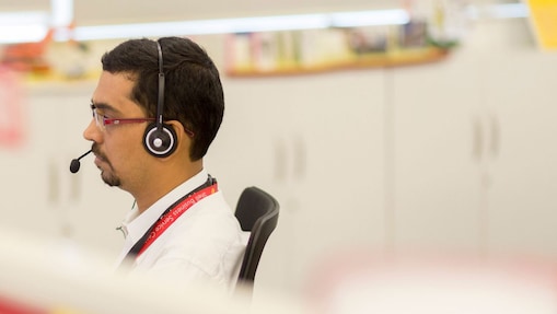 Man using headset in call centre