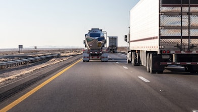  lorries driving along a road