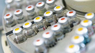 Vials of samples on an auto sampler