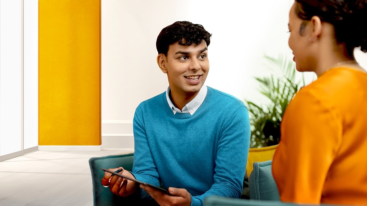 Employee speaking to a colleague