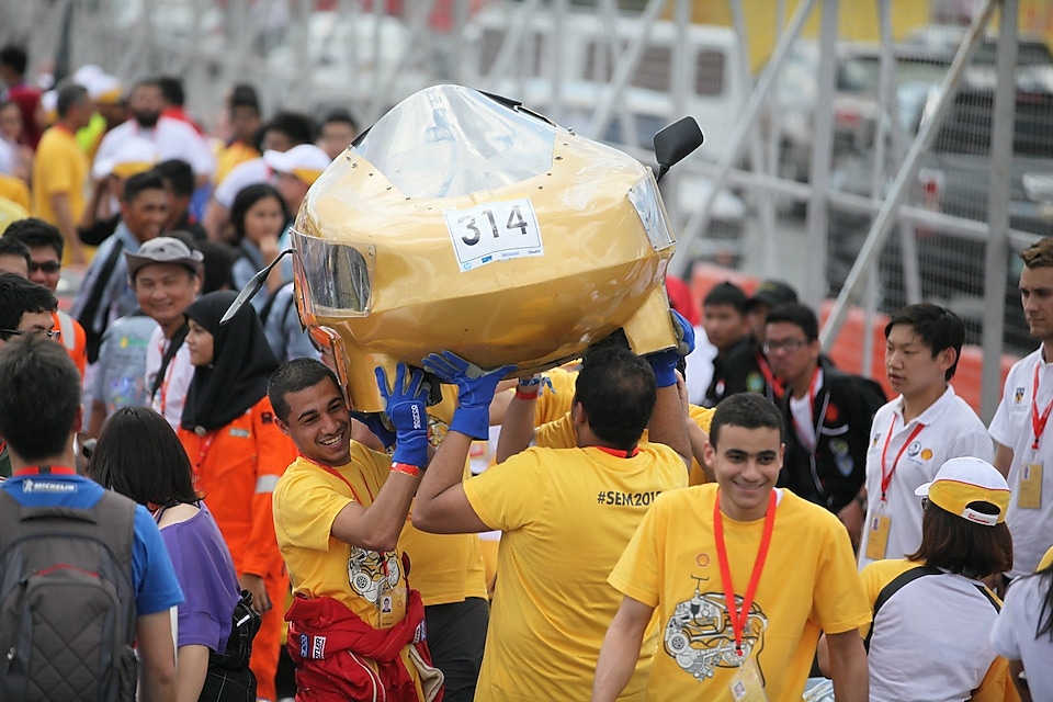 The Cleopatra, #314, Prototype, competing for Alexandria University Shell Eco-marathon Team from Alexandria University Faculty of Engineering, Egypt carries their car onto the track during day one of the Shell Eco-marathon in Manila, Philippines, Thursday, Feb. 26, 2015.