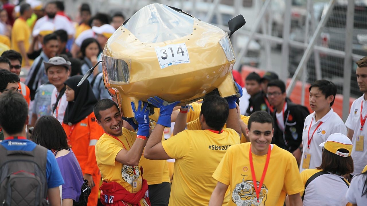 The Cleopatra, #314, Prototype, competing for Alexandria University Shell Eco-marathon Team from Alexandria University Faculty of Engineering, Egypt carries their car onto the track during day one of the Shell Eco-marathon in Manila, Philippines, Thursday, Feb. 26, 2015.