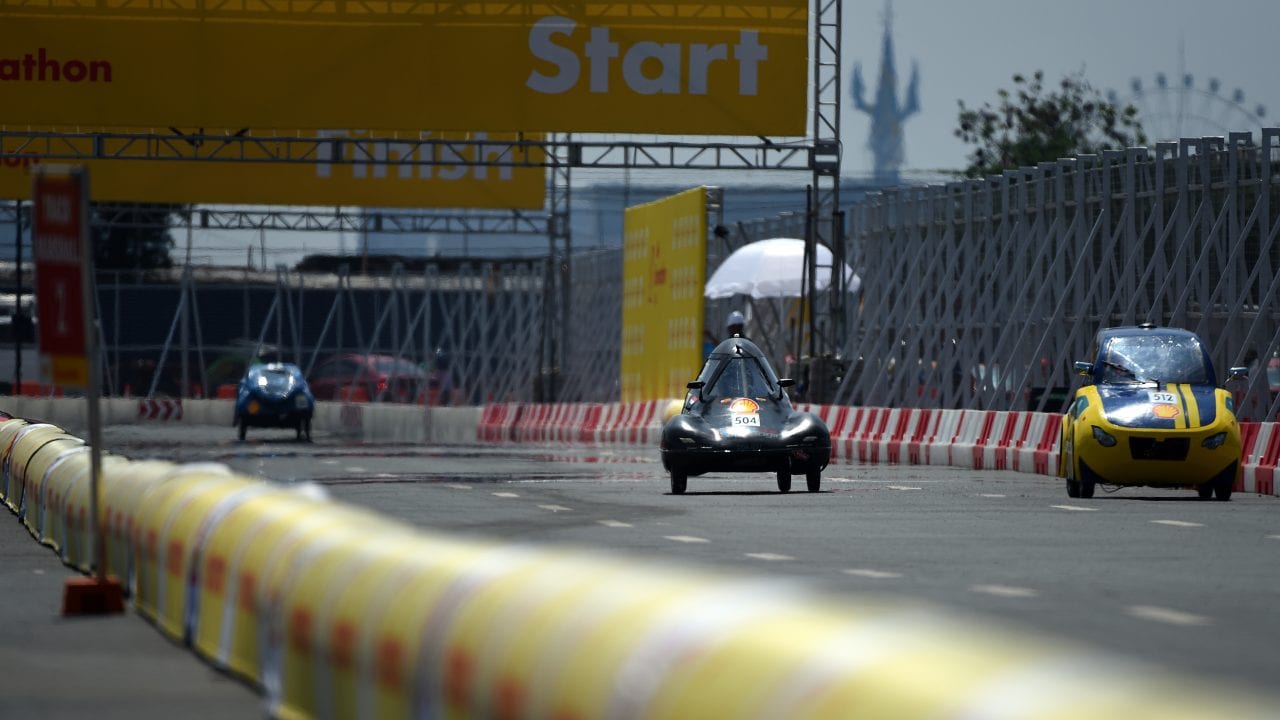 The Anubis II, #512, a gasoline UrbanConcept vehicle from team CUT Eco-Racing UC at the Cairo University Faculty of Engineering in Giza, Egypt, runs along the track with the Sapuangin 10, #504, a diesel UrbanConcept vehicle from ITS Team 2 at the Institut Teknologi Sepuluh Nopember in Surabaya, Indonesia, during day three of the Shell Eco-marathon Asia in Manila, Philippines, Saturday, March 5, 2016. 
