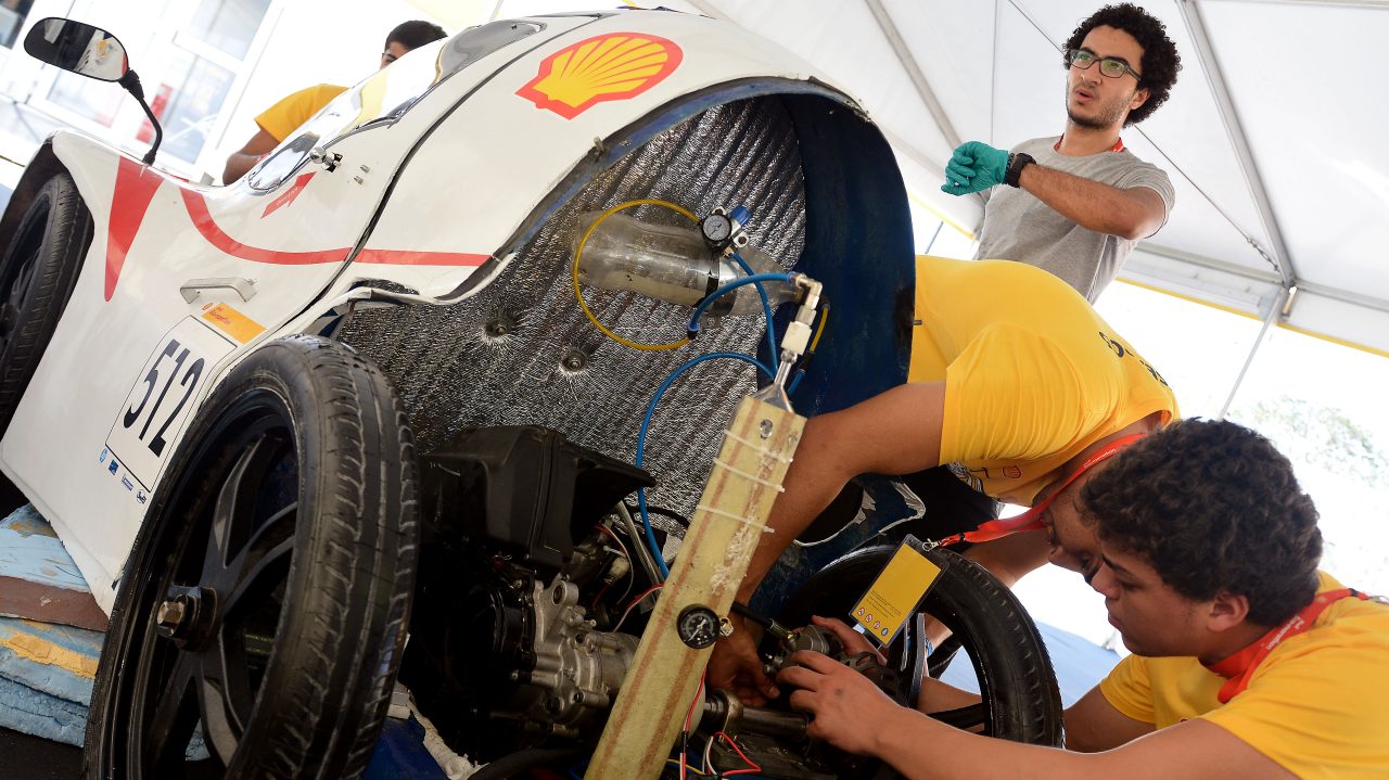 Team members work on the Anubis, #512, UrbanConcept, competing for team CUT Eco-Racing UC from Cairo University Faculty of Engineering , Egypt during day two of the Shell Eco-marathon in Manila, Philippines, Friday, Feb. 27, 2015.