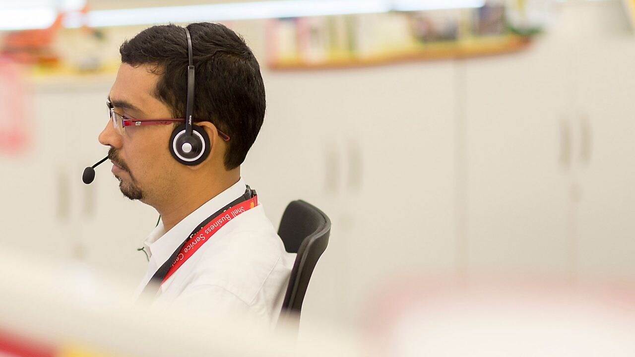 Man using headset in call centre