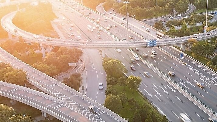 Cars driving on a complicated highway infrastructure with over and under passes
