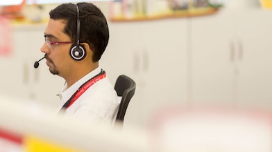 Man using headset in call centre