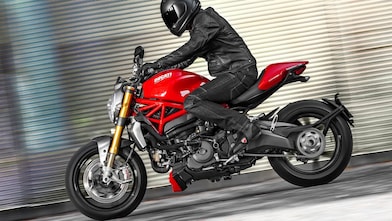 Man riding a bike which is using the Superior Engine Oil For Bikes